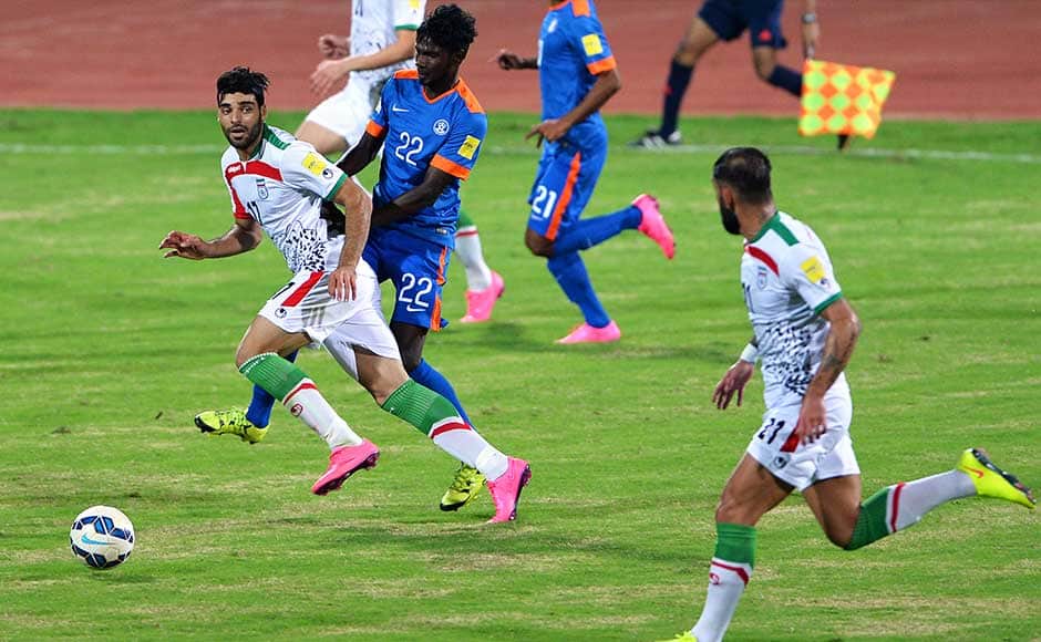 India were pretty much on the defensive in the first half. But Iran came out all guns blazing in the second half. Andranik Teymourian doubled the lead in the 47th minute as Indian goalkeeper Gurpreet Singh was guilty of ball watching and the Indian defense allowed Taromi to head back an outgoing ball to Andranik who smashed it home from inside the box. (In pic) Iranian player Mehdi Taremi (L) vies for the ball with Indian player Rowllin (C). AFP