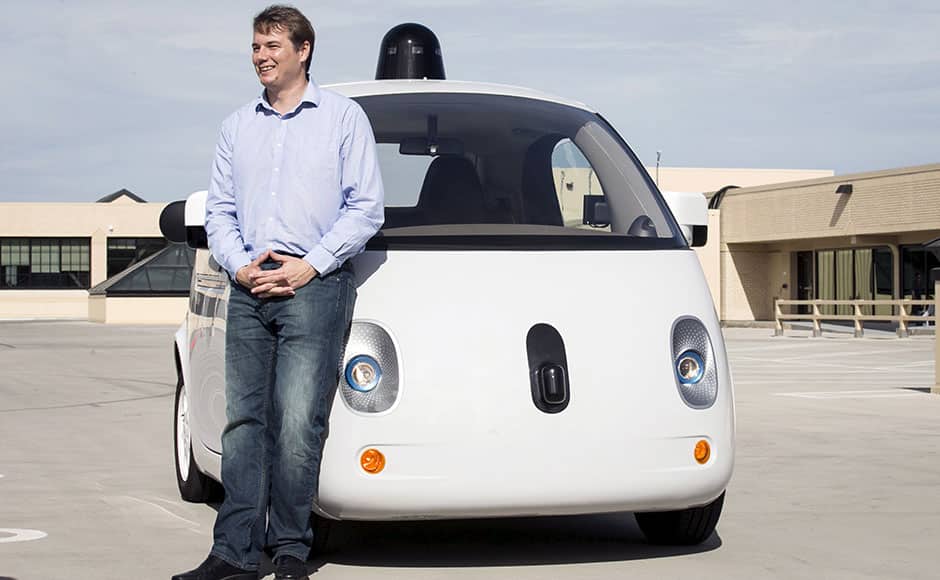 Chris Urmson, Director of the Self Driving Cars Project at Google, poses for photos in front of a prototype self-driving car during a media preview of Google's prototype autonomous vehicles in Moutain View, California September 29, 2015. REUTERS