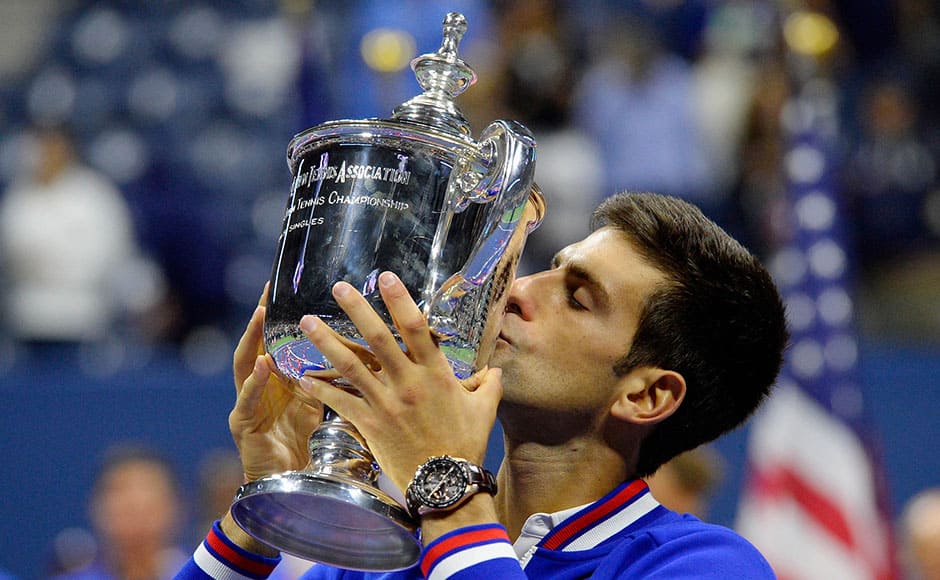 Sep 13, 2015; New York, NY, USA; Novak Djokovic of Serbia kisses the US Open Trophy after beating Roger Federer of Switzerland in the men's singles final on day fourteen of the 2015 U.S. Open tennis tournament at USTA Billie Jean King National Tennis Center. Mandatory Credit: Robert Deutsch-USA TODAY Sports - RTSXOW