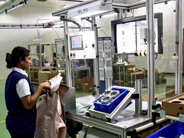 A worker scans the barcode on an air bag inside a factory of air bag maker Rane TRW Steering System Ltd at Singaperumal Koil in the southern state of Tamil Nadu, India, September 10, 2015. The world's largest air bag suppliers are setting up plants and ramping up capacity in India, eyeing a $2 billion opportunity thanks to tougher rules aimed at improving one of the world's worst road-safety records. To match INDIA-SAFETY/AIRBAGS/ REUTERS/Stringer - RTSTKL
