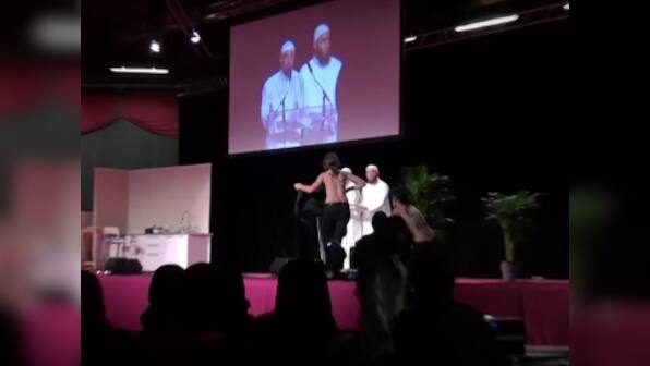Femen activists dragged off stage at France Islam event for topless protest