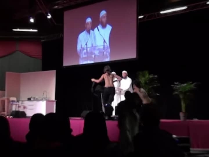 Femen activists dragged off stage at France Islam event for topless protest