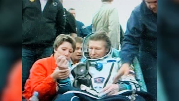 Down to earth: Russian cosmonaut returns after spending record 879 days in space