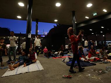 Migrants at a railway station in Budapest. Image courtesy: AP
