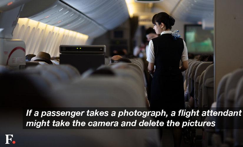 If-a-passenger-takes-a-photograph,-a-flight-attendant-might-take-the-camera-and-delete-the-pictures