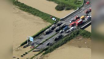 Thousands of rescuers deployed as Japan floods kill three and leave 25 people missing