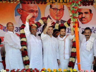 Congress vice-president Rahul Gandhi with RJD leader Tejaswi Yadav and JD(U)'s KC Tyagi at Ramnagar in West Champaran district of Bihar on Saturday. PTI
