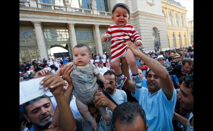 Chaos at railway station in Budapest as thousands of asylum-seekers seek entry into trains
