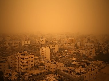 A picture taken on September 8, 2015, shows Gaza City shrouded in a thick cloud of dust as a sandstorm engulfs parts of the Middle East. AFP
