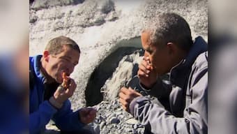 Watch: Obama gets bear's leftover fish for snack on an outing with Bear Grylls