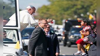 Little girl breaks through security to deliver message on immigration to Pope Francis