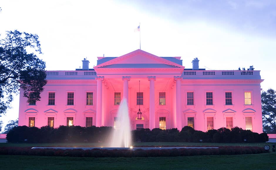 The White House is illuminated with pink to observe Breast Cancer Awareness Month in Washington DC, October 9, 2015. AFP PHOTO