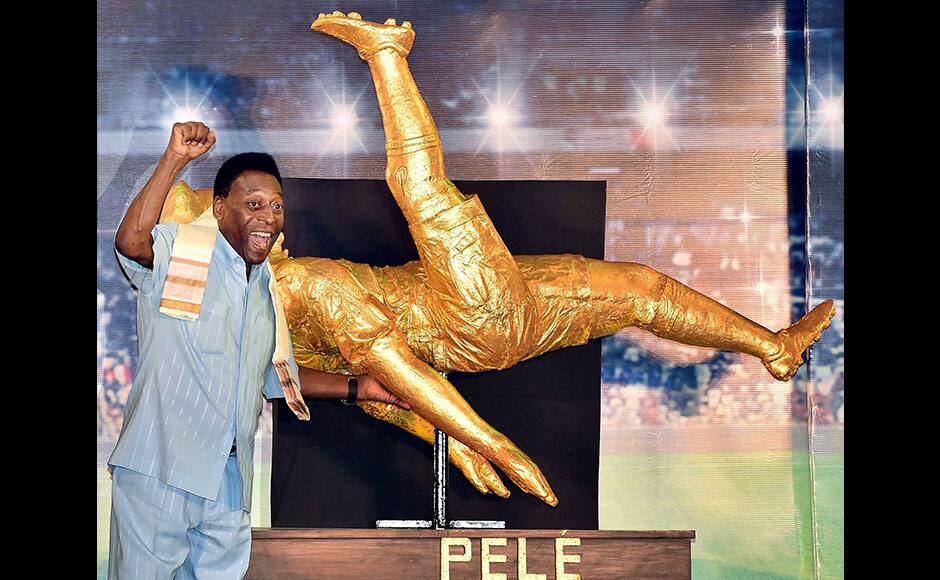 Kolkata: Legendary Brazilian footballer Pele reacts after unveiling a sculpture of his famous bi-cycle shot during an interaction with students in Kolkata on Monday evening. PTI