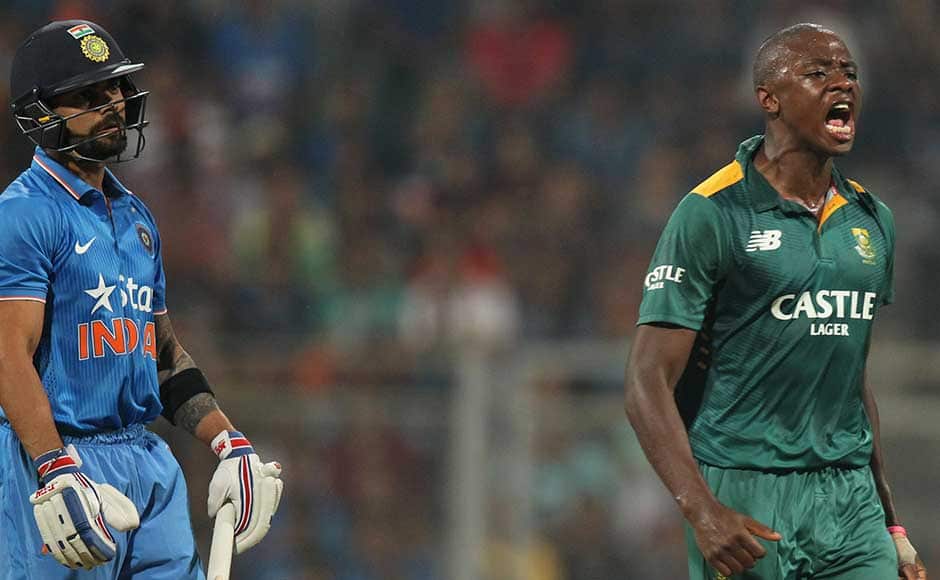 South African Kagiso Rabada, right, celebrates the wicket of India’s Virat Kohli, left, during the final one-day international cricket match of a five-game series in Mumbai, India, Sunday, Oct. 25, 2015. (AP Photo/Rafiq Maqbool)