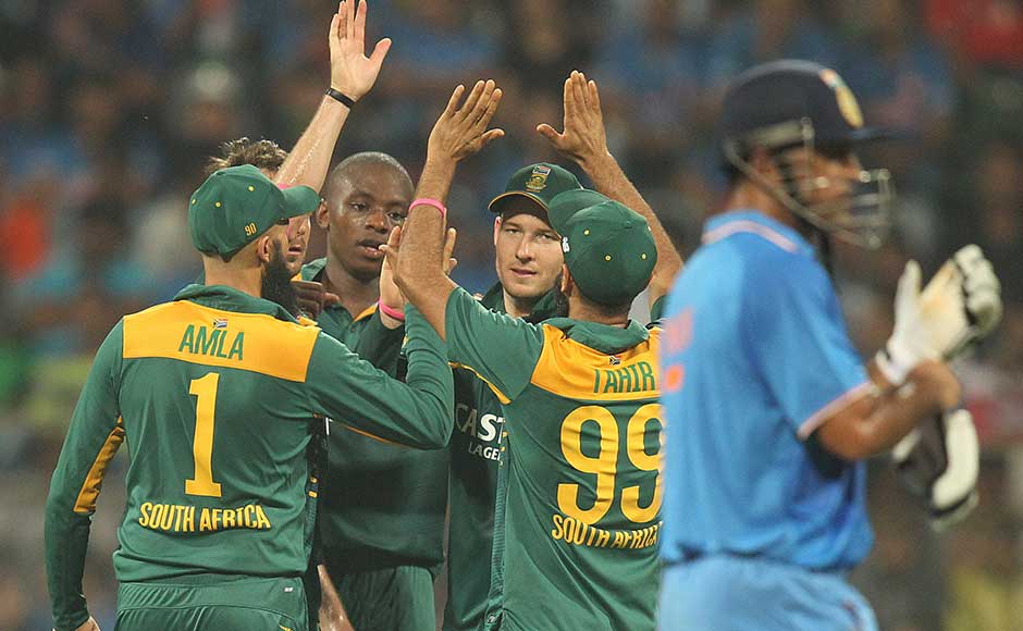 South African players celebrate the wicket of India’s Axar Patel, during the final one-day international cricket match of a five-game series in Mumbai, India, Sunday, Oct. 25, 2015. (AP Photo/Rafiq Maqbool)