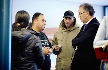 Rotterdam mayor Ahmed Aboutaleb (R) visits refugees in the sports center of the Erasmus University in Rotterdam, The Netherlands, September 18, 2015. Rotterdam made 250 beds available for temporary shelters that were necessary because the regular shelter places are not ready on time. AFP.