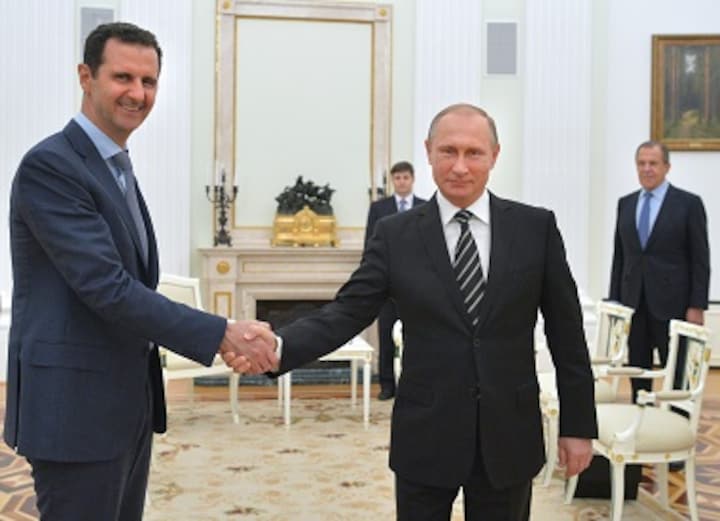 President Bashar al-Assad of Syria visits Vladimir Putin in Moscow on first foreign visit in four years