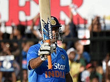 India's MS Dhoni celebrates his half century in Indore . PTI photo 