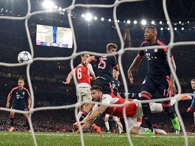 Olivier Giroud scores the first goal for Arsenal against Bayern Munich. Reuters