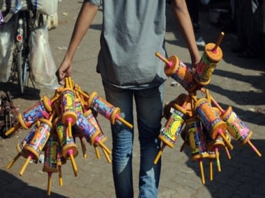 A youth holds special kite-reels wound with 'manjha — kite-flying thread prepared by coating a cotton thread with a mix of glue and ground glass. AFP