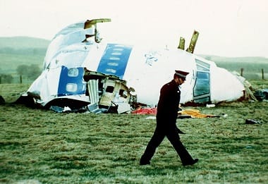 FILE - In this Wednesday, Dec. 21, 1988 file photo, a police officer walks by the nose of Pan Am flight 103 in a field near the town of Lockerbie, Scotland where it lay after a bomb aboard exploded, killing a total of 270 people. AP 