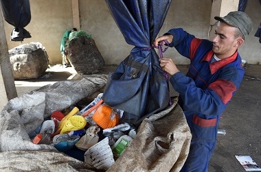 Moroccan labourers recycle waste at the Attawafoq cooperative at Oum Azza industrial landfill, in Ain Aouda, south of Rabat, on October 5, 2015. AFP