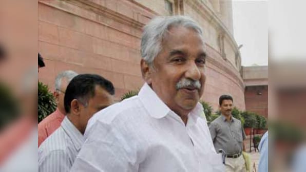 Pushed to the wall by con woman, Kerala CM Chandy feels Solar scam heat