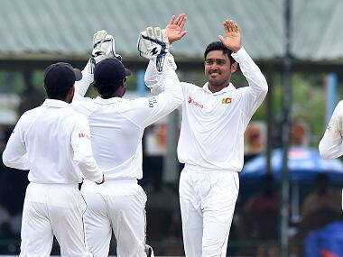 Milinda Siriwardana (2R) celebrates with teammates after dismissing Jermaine Blackwood. AFP