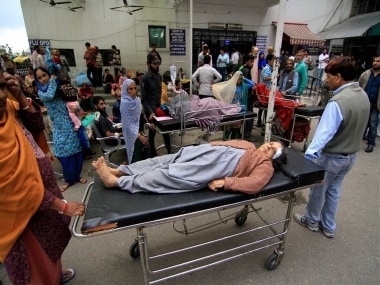 An injured people take first-aid at Govt Medical College hospital after earthquake in Jammu on Monday. PTI