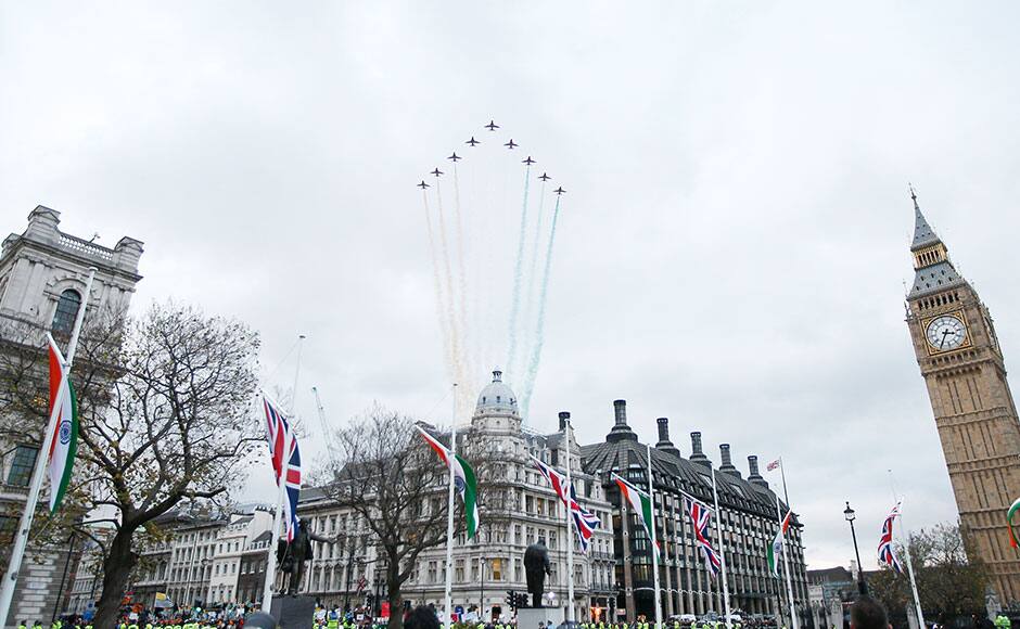 The Red Arrow RAF display team perform a flypast over Parliament Square in honour of India's Prime Minister Narendra Modi in London, November 12, 2015. REUTERS
