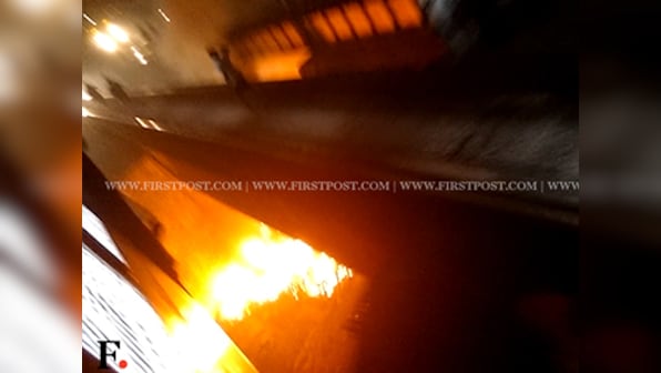 Watch: Huge fire engulfs culvert below railway tracks in Mumbai