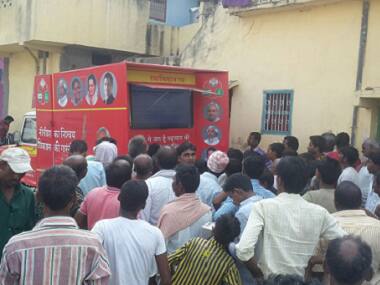 Locals gather around a . Tarique Anwar/Firstpost
