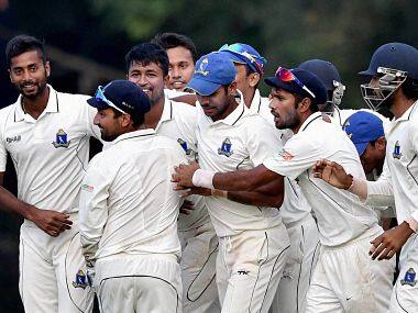 Pragyan Ojha and Bengal teammates celebrate their win. PTI