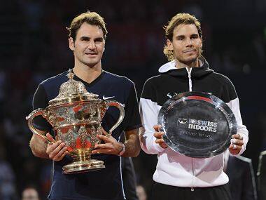 Roger Federer (L) poses with his Basel open trophy next to Rafael Nadal. AFP