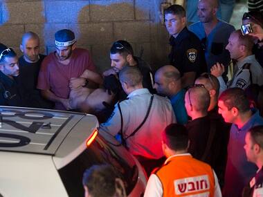 Police arrest a Palestinian identified as Raed Khalil bin Mahmoud, a 36-year-old from the West Bank village of Dura in Tel Aviv, Israel on Thursday for allegedly fatally stabbing two Israeli men in a Tel Aviv office building on Thursday. AP 