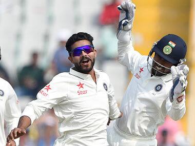 Ravindra Jadeja (C) celebrates on Day 3 in Mohali. AFP
