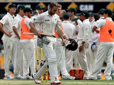 Australia's players celebrates the dismissal Kane Williamson at Gabba. AFP