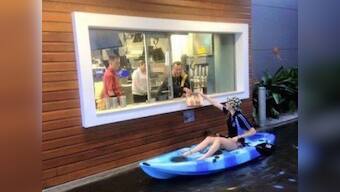 Cheeseburger love: Australian teen kayaks her way through the flood to McDonald's