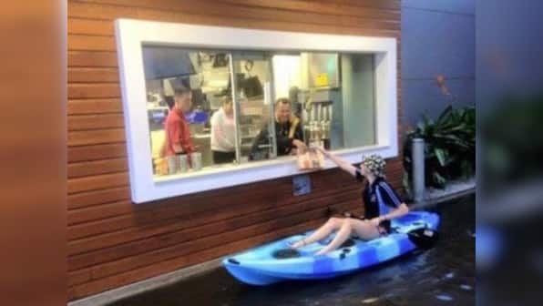 Cheeseburger love: Australian teen kayaks her way through the flood to McDonald's