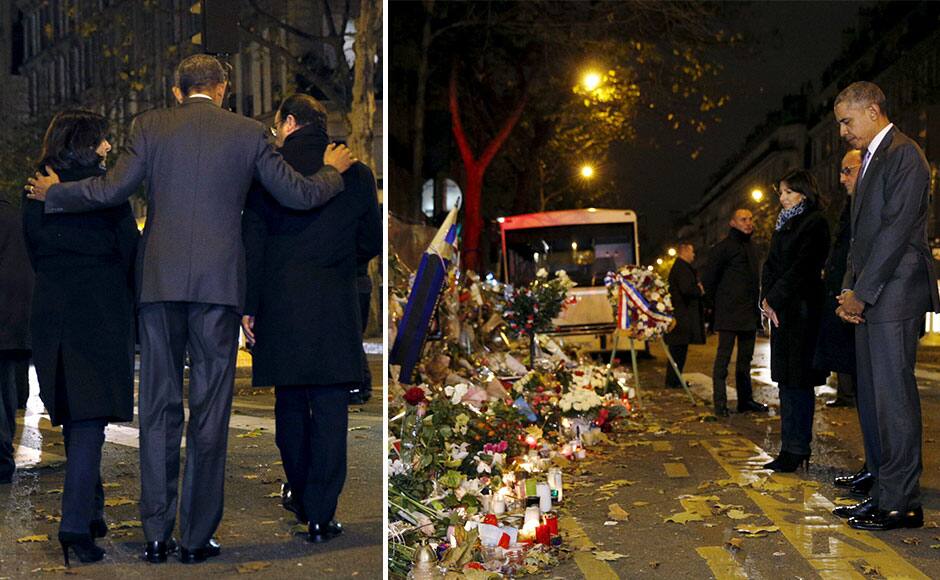 U.S. President Barack Obama, French President Francois Hollande (R) and Paris Mayor Anne Hidalgo (L) walk away after placing flowers at a makeshift memorial to pay tribute to the victims of the Paris attacks at the Bataclan in Paris November 30, 2015. REUTERS