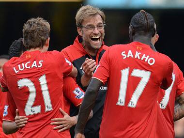 Liverpool manager Juergen Klopp celebrates with his players after beating Chelsea. Reuters