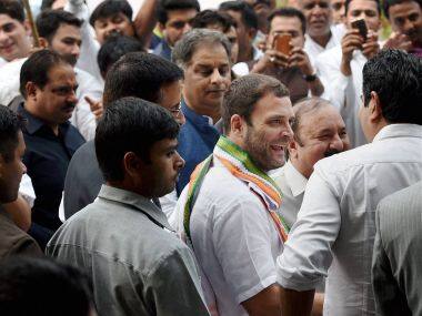 All smiles: Rahul Gandhi with Congress workers in New Delhi on Sunday. PTI