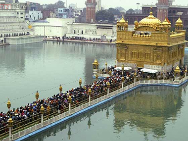Akal Takht protests: Radical Sikh agitators raise black flags, swords at Golden Temple Akal Takht protests: Radical Sikh agitators raise black flags, swords at Golden Temple