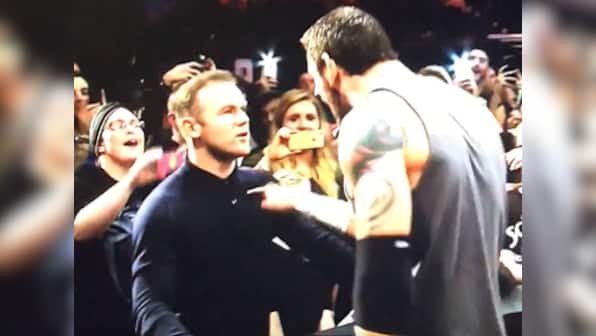 Trading in his foot for his hand, Man Utd striker Rooney puts the hurt on WWE's Barrett