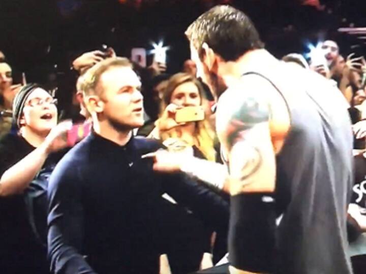 Trading in his foot for his hand, Man Utd striker Rooney puts the hurt on WWE's Barrett
