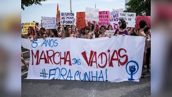 Topless, with slogans scrawled on bare skin, Brazilian women strip to say 'my body, my rules'