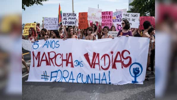 Topless, with slogans scrawled on bare skin, Brazilian women strip to say 'my body, my rules'