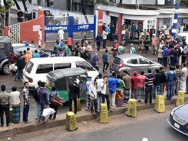 Onlookers gather outside the Isha Khan naval base where two small bombs exploded at a mosque. AFP 