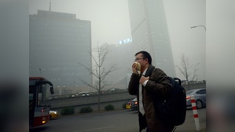 Schools closed, Beijing traffic slashed after first pollution red-alert
