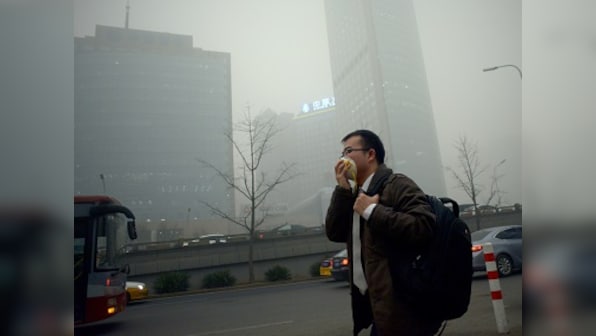 Schools closed, Beijing traffic slashed after first pollution red-alert